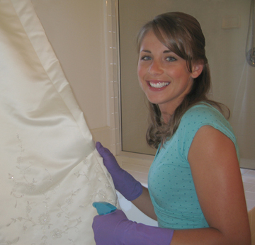 Bride cleaning gown
