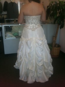 Ashley tries on her wedding dress for the first time. 