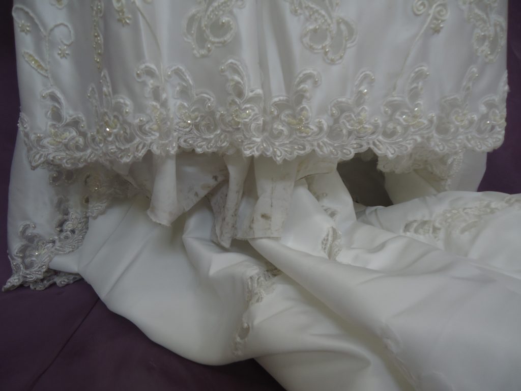 Hemline of before wedding dress restoration