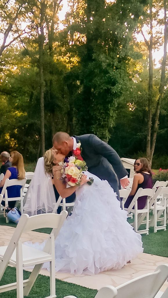 Wedding dress preservation bride and groom kissing