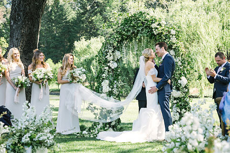 Mackenzie's beautiful outdoor wedding left her hemline dirty. Expert wedding dress cleaning and wedding dress preservation returned the gown to a pristine condition.