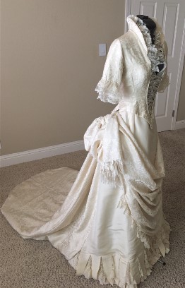 Mary Anne's wedding gown restoration is complete. It took a while to determine where to attach all of the pieces of the vintage bridal gown.
