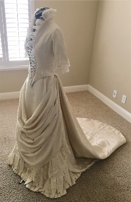 The bride who wore this wedding dress nearly 150 years ago couldn't have even been a size one. It is a very tiny dress.