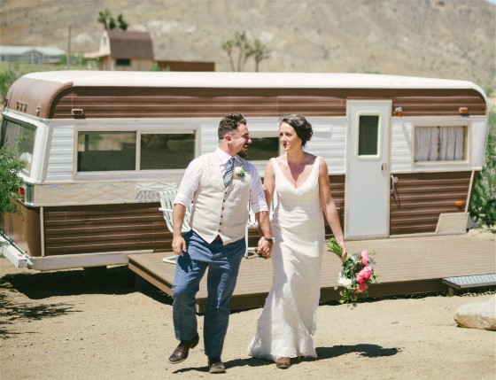 A desert wedding is beautiful but leaves desert dirt behind, needing wedding dress cleaning.