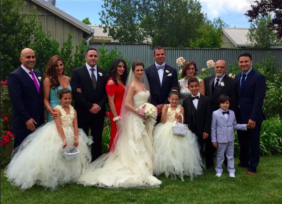 Laurel's Bridal Party with adorable flower girls in ruffled gown similar to the bride.