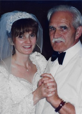 Margaret enjoys dance on her wedding day. Her wedding dress restoration ensures her gown can be worn again.