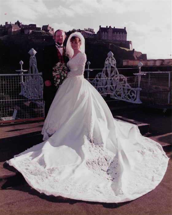 Margaret and new husband enjoy beautiful Scottish castle background on their wedding day.