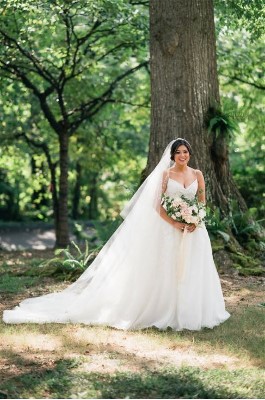 Stepahnie's wedding dress is unique with custom veil and train. Wedding dress preservation will keep it in the best condition.