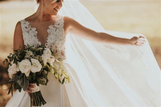 Kelsey's wedding dress preservation will keep her Lazaro gown beautiful.