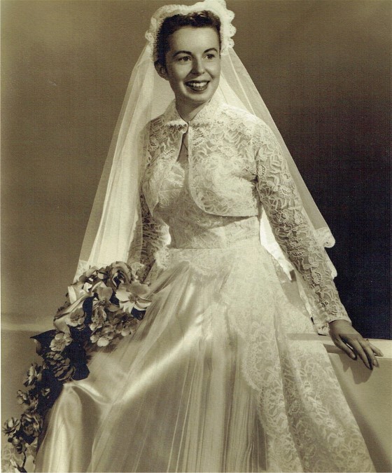 Joyce is married in lace and satin wedding dress in 1955.