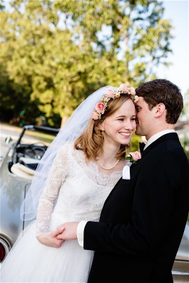 Ellen and husband on wedding day. Ellen wears grandmother's gown after wedding dress restoration.