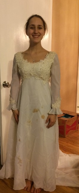 Meredith trying on her mother's wedding dress