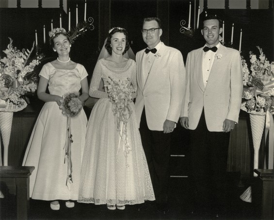 The whole wedding party.  Mom looks beautiful in her wedding dress. Wedding dress restoration made her gown gorgeous again.