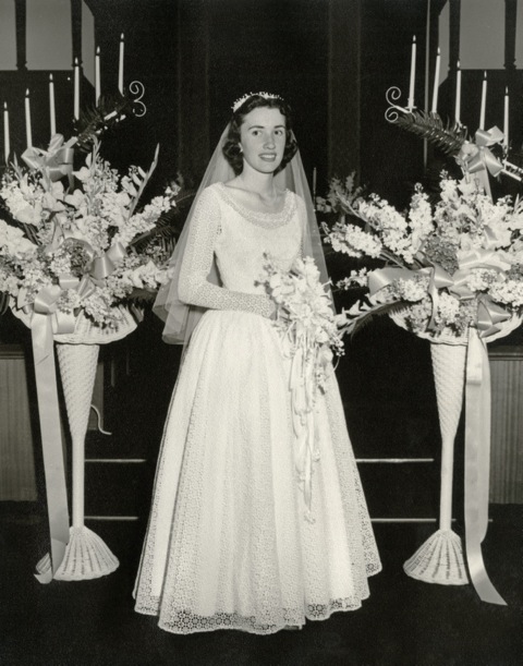 Emma Hulett on her wedding day. Wedding dress restoration will allow someone else to wear her gown again someday.