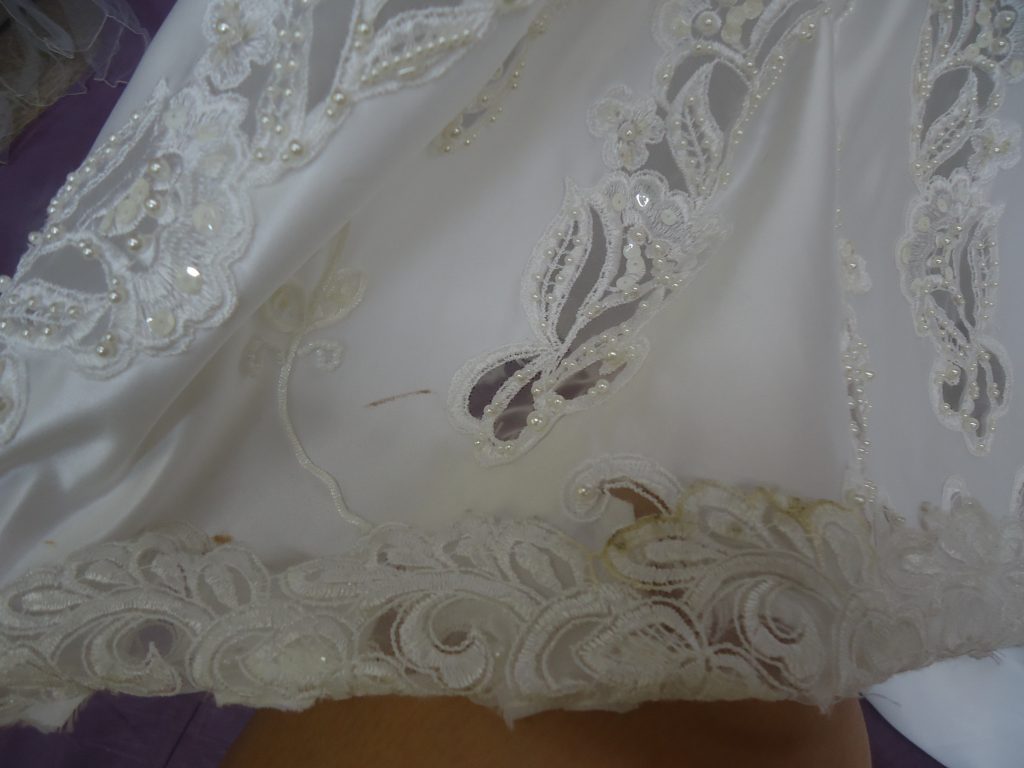 Before wedding gown restoration close up