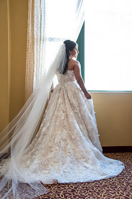 Carissa enjoys her beautiful gown. Wedding dress preservation will keep it beautiful forever.