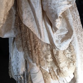 19th century wedding gown receives wedding dress restoration to whiten fabric and lace.