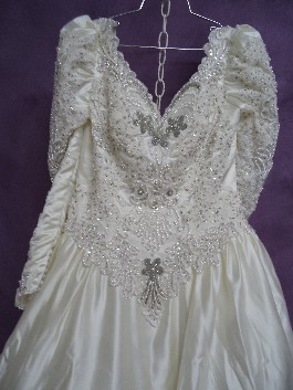 Margaret's wedding dress before wedding dress restoration. It has yellowed slightly and the beads have oxidized.