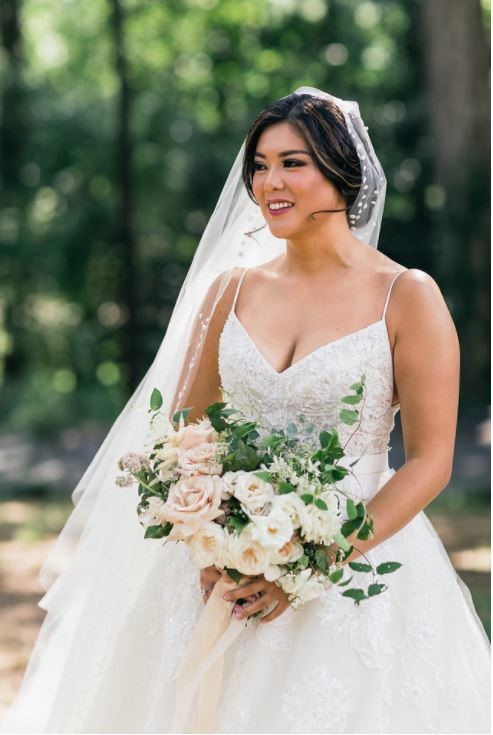 Stephanie looks radiant on her wedding day. Wedding dress preservation ensures another bride will wear her gown some day. 