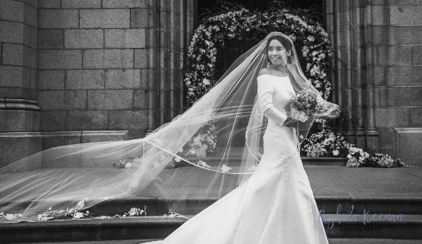 Note the three quarter sleeves and trumpet style skirt of megan Markle wedding dress replica by Shauna Fay.