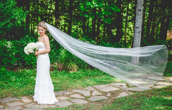 Wedding dress cleaning made Kelsey's hemline pristine even after outdoor photos.