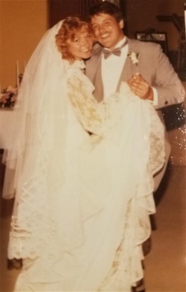 Kerry and Kathleen dance on their wedding day. Wedding dress restoration made Kathleen's gown beautiful again so her daughter could wear it.