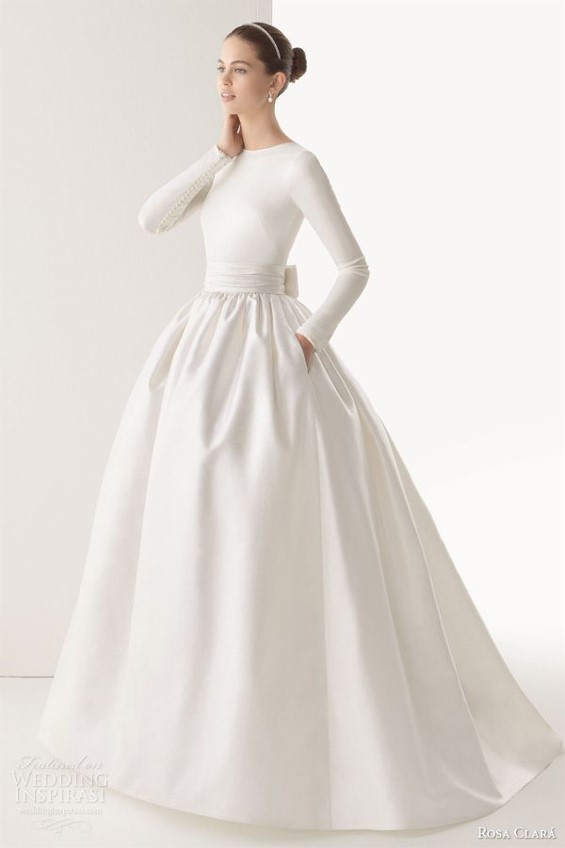 Simple and beautiful long sleeve wedding  dress from Rosa Clara will keep a bride much warmer than in a strapless gown.