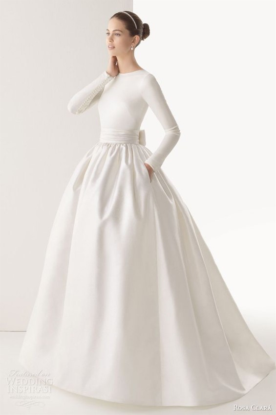 Simple and beautiful long sleeve wedding dress from Rosa Clara will keep a bride much warmer than in a strapless gown.