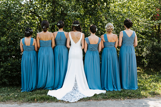 The back view of Adrienne and her bridesmaid's dresses.